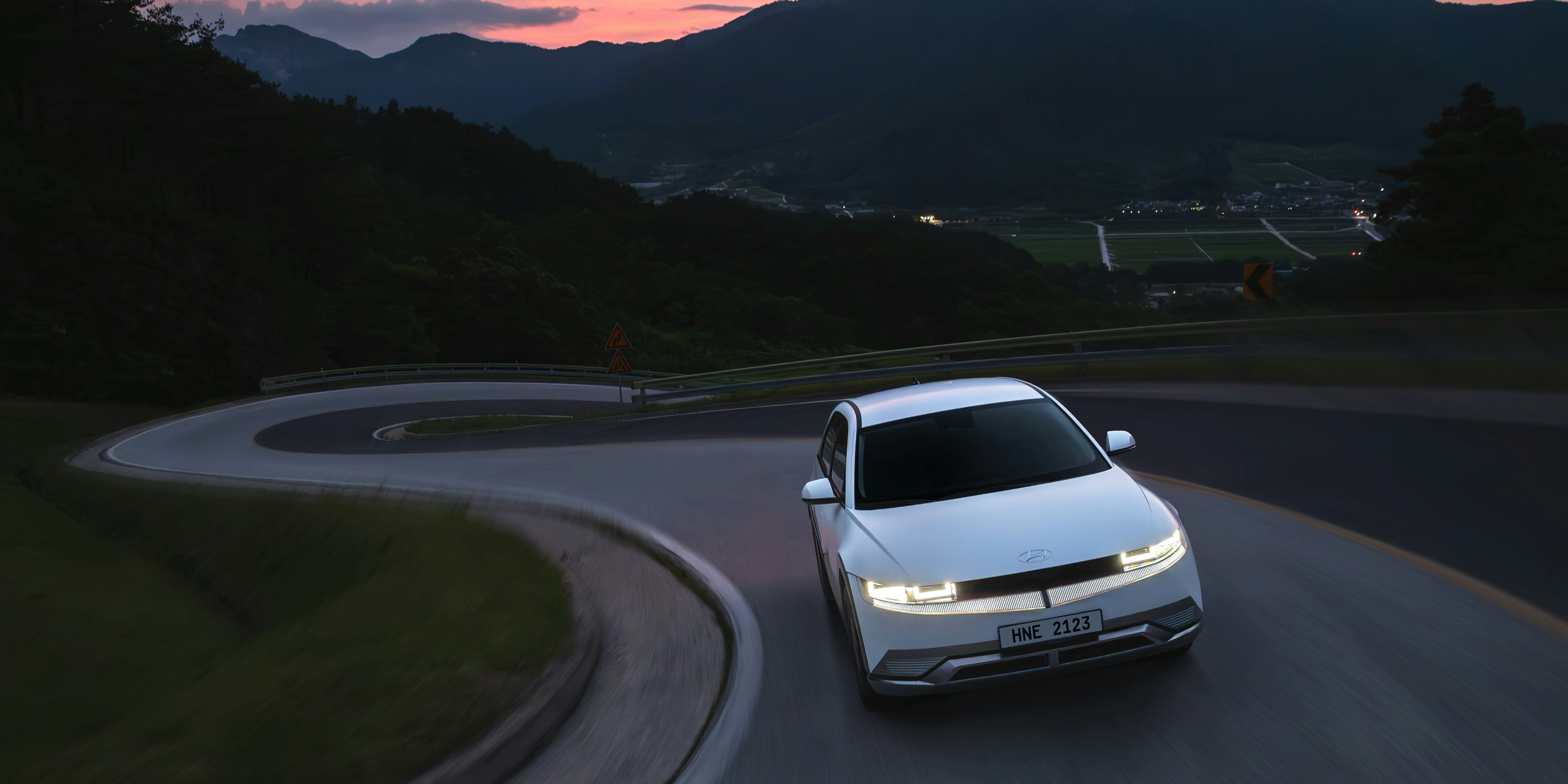 Electric vehicle in Pacific Northwest landscape